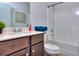 Bathroom featuring a modern vanity with a white countertop, a sink, and a shower-tub combo at 11118 Benton Woods Dr, Covington, GA 30014