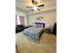 Main bedroom showcasing neutral colors and a ceiling fan at 11118 Benton Woods Dr, Covington, GA 30014