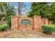 Benton Woods subdivision entrance with brick sign and mature trees; a beautiful welcome to the community at 11118 Benton Woods Dr, Covington, GA 30014