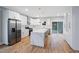 Modern kitchen with white cabinets, stainless steel appliances and island at 2195 Springdale Sw Rd, Atlanta, GA 30315