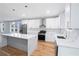 Modern kitchen with white cabinets, marble countertops, and stainless steel appliances at 2195 Springdale Sw Rd, Atlanta, GA 30315