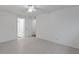 Bedroom with tile floors, ceiling fan and access to closets at 3242 Henderson Mill Rd # 3, Atlanta, GA 30341