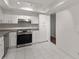 Modern kitchen with stainless steel appliances and granite countertops at 3242 Henderson Mill Rd # 3, Atlanta, GA 30341