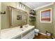 Charming bathroom with updated vanity and shelving at 1925 Annwicks Dr, Marietta, GA 30062