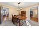 Dining room with hardwood floors, a wooden table, and a view of the kitchen at 1925 Annwicks Dr, Marietta, GA 30062