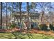 Two-story house with green siding, shutters, and a large yard at 1925 Annwicks Dr, Marietta, GA 30062