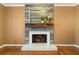 Fireplace with a rustic mantel and unique wall covering at 1925 Annwicks Dr, Marietta, GA 30062