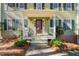 Inviting front porch with a white railing and a red door at 1925 Annwicks Dr, Marietta, GA 30062