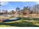 Serene lakefront view with dock and canoe at 1925 Annwicks Dr, Marietta, GA 30062