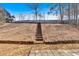 View of sloped backyard with stairs at 2124 Berryhill Se Cir, Smyrna, GA 30082