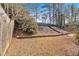 Sloped backyard with retaining wall and stairs at 2124 Berryhill Se Cir, Smyrna, GA 30082