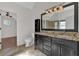 Bathroom with double vanity, granite countertops, and a large mirror at 2124 Berryhill Se Cir, Smyrna, GA 30082