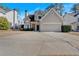 Two-story house exterior with stone accents and two car garage at 2124 Berryhill Se Cir, Smyrna, GA 30082