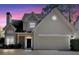 Two-story house exterior at dusk with stone accents at 2124 Berryhill Se Cir, Smyrna, GA 30082