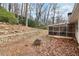 Landscaped backyard with fire pit and stone retaining wall at 2481 Brookdale Dr, Atlanta, GA 30345