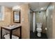 Basement bathroom with toilet, shower, and updated vanity at 2481 Brookdale Dr, Atlanta, GA 30345