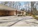 Covered carport attached to a brick house at 2481 Brookdale Dr, Atlanta, GA 30345