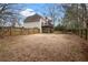 Large backyard with wooden fence and a view of the house at 3210 Garmon Oak Trl, Lawrenceville, GA 30044