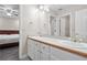 Double vanity bathroom with a view of bedroom at 3210 Garmon Oak Trl, Lawrenceville, GA 30044