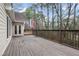 Wooden deck with access from the house, overlooking a wooded area at 3210 Garmon Oak Trl, Lawrenceville, GA 30044