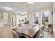 Kitchen and dining area with hardwood floors and large table at 3210 Garmon Oak Trl, Lawrenceville, GA 30044