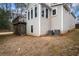 Rear view of the house showing the deck and HVAC units at 3210 Garmon Oak Trl, Lawrenceville, GA 30044