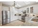 Spacious kitchen with white cabinets and granite countertops at 3210 Garmon Oak Trl, Lawrenceville, GA 30044