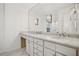 Elegant bathroom with double vanity, marble countertops and large mirror at 1992 Walthall Nw Dr, Atlanta, GA 30318