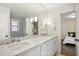 Bathroom with double vanity and marble countertop at 1992 Walthall Nw Dr, Atlanta, GA 30318