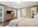 Spacious bedroom with hardwood floors and access to another room at 1992 Walthall Nw Dr, Atlanta, GA 30318