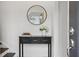 Bright entryway features a console table, mirror, and fresh flowers at 1992 Walthall Nw Dr, Atlanta, GA 30318