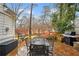 Stone patio with outdoor dining set and grill at 1992 Walthall Nw Dr, Atlanta, GA 30318