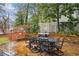 Stone patio with outdoor dining set and grill at 1992 Walthall Nw Dr, Atlanta, GA 30318