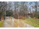 Metal pedestrian bridge over a creek in a wooded area at 1992 Walthall Nw Dr, Atlanta, GA 30318