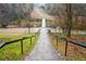 Stone steps leading to a footbridge over a creek at 1992 Walthall Nw Dr, Atlanta, GA 30318