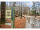 Paved walking trail near a creek and trees at 1992 Walthall Nw Dr, Atlanta, GA 30318