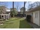 Large backyard with playhouse, fire pit, and detached garage at 2071 Howard Circle Ne, Atlanta, GA 30307