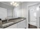 Bathroom with granite countertop, double vanity, and shower/tub at 2071 Howard Circle Ne, Atlanta, GA 30307