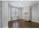 Bedroom with hardwood floors, built-in shelving, and window at 2071 Howard Circle Ne, Atlanta, GA 30307