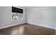 Well-lit bedroom featuring hardwood floors and a large window at 2071 Howard Circle Ne, Atlanta, GA 30307