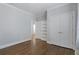 Bedroom with hardwood floors and built-in shelving and doors at 2071 Howard Circle Ne, Atlanta, GA 30307