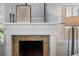 White fireplace with decorative tile surround at 2071 Howard Circle Ne, Atlanta, GA 30307