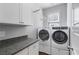 Laundry room with washer, dryer, and granite countertop at 2071 Howard Circle Ne, Atlanta, GA 30307