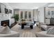 Open concept living room with fireplace and French doors at 2071 Howard Circle Ne, Atlanta, GA 30307