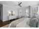 Main bedroom with hardwood floors, sitting area, and ceiling fan at 2071 Howard Circle Ne, Atlanta, GA 30307