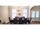 Bright dining room with hardwood floors and a chandelier at 213 Cades Ct, Mcdonough, GA 30252