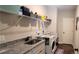 Bright laundry room with washer, dryer, and ample storage at 213 Cades Ct, Mcdonough, GA 30252