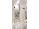 Walk-in shower with marble tile and modern fixtures at 213 Cades Ct, Mcdonough, GA 30252