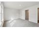 A spacious bedroom with carpet, natural light, and a view to an adjacent closet space at 3921 Brushy St, Powder Springs, GA 30127