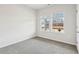 Bright bedroom features neutral walls, plush carpet, and natural light from two windows at 3921 Brushy St, Powder Springs, GA 30127